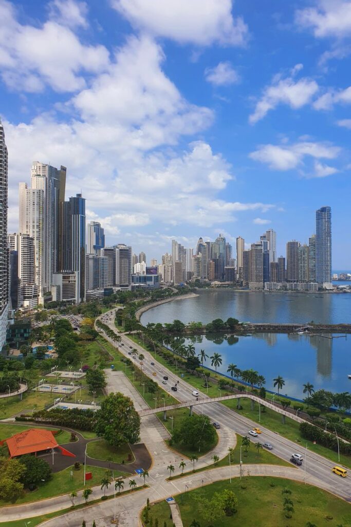 A breathtaking view of Panama City's modern skyline and oceanfront under a blue sky.