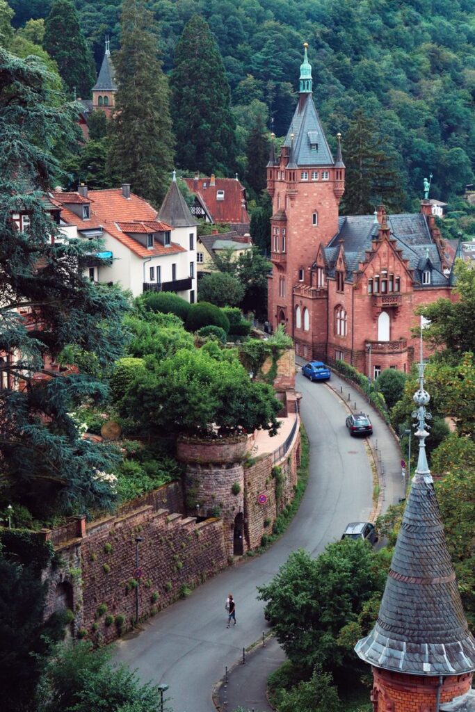 Gothic architecture amidst lush greenery in Heidelberg, Germany.