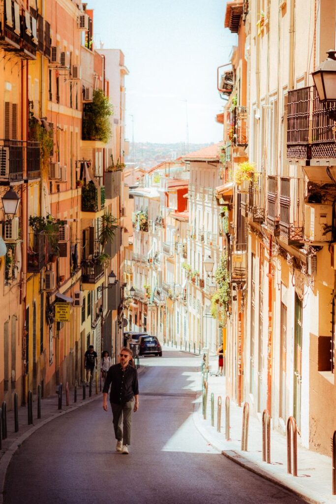 Picturesque view of a sunlit street in Madrid, capturing the essence of the city's vibrant architecture.