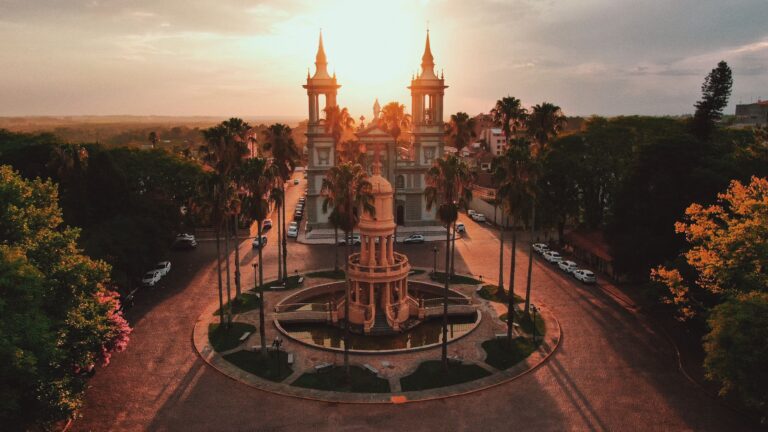 A stunning aerial view of the Basilica during sunset in Rio Grande do Sul, Brazil, capturing warm tones and architectural beauty.